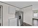 Close-up of kitchen area featuring stainless steel refrigerator and modern cabinets at 17442 Eve Dr, Montverde, FL 34756