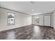Bright and spacious living room features new flooring, crisp, neutral walls, and sunlit windows at 17442 Eve Dr, Montverde, FL 34756