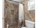 Bathroom features walk-in shower, tiled walls, and pebble tile shower floor at 1854 W Schwartz Blvd, Lady Lake, FL 32159