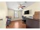 Bedroom features a ceiling fan, wood floors, and a window with blinds at 1854 W Schwartz Blvd, Lady Lake, FL 32159