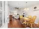 Inviting dining area with wood floors, open floor plan and cozy atmosphere at 1854 W Schwartz Blvd, Lady Lake, FL 32159