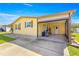 This single-story home has a large open garage with a concrete driveway at 1854 W Schwartz Blvd, Lady Lake, FL 32159