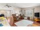 A cozy living room features comfortable furniture, natural light, and neutral decor at 1854 W Schwartz Blvd, Lady Lake, FL 32159