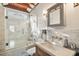 Modern bathroom features marble tile, unique shower, and a vintage vanity at 219 W 9Th Ave, Mount Dora, FL 32757