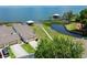 Stunning aerial view of waterfront home with private dock, lush landscaping, and access to beautiful blue waters at 2229 Cypress Ct # C-4, Tavares, FL 32778