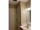 Powder bathroom with single vanity, tile floors and neutral paint at 2229 Cypress Ct # C-4, Tavares, FL 32778