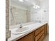 Bathroom featuring a double sink vanity and shower over bath at 2229 Cypress Ct # C-4, Tavares, FL 32778