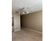 Bedroom with neutral carpet, paint, and large closet space at 2229 Cypress Ct # C-4, Tavares, FL 32778