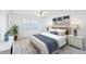 Calming bedroom design with a woven headboard and light-filled window at 2229 Cypress Ct # C-4, Tavares, FL 32778