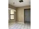 Traditional dining area featuring tile floors, updated light fixture, and a large picture window for lots of natural light at 2229 Cypress Ct # C-4, Tavares, FL 32778