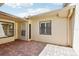 Inviting brick patio offers a serene outdoor living space with bright natural light and views of the surrounding yard at 2229 Cypress Ct # C-4, Tavares, FL 32778