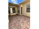 Cozy brick-paved patio with ample space for outdoor seating, creating a welcoming and relaxing outdoor area at 2229 Cypress Ct # C-4, Tavares, FL 32778