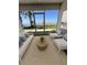 Relaxing screened-in patio offering picturesque waterfront views and neutral colored patio furniture at 2229 Cypress Ct # C-4, Tavares, FL 32778