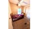 Cozy bedroom with a ceiling fan, closet, and comfortable bed at 224 Westwood Dr, Leesburg, FL 34748