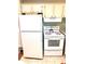 Bright kitchen with white appliances, including a refrigerator and oven at 224 Westwood Dr, Leesburg, FL 34748