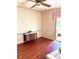 Spacious living room with wood-look floors and a sliding glass door to the outside at 224 Westwood Dr, Leesburg, FL 34748