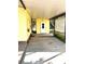 Open back patio with side door entry and mature landscaping with plenty of room to entertain guests at 224 Westwood Dr, Leesburg, FL 34748