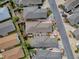 Aerial view showcasing the property's layout, landscaping, and proximity to surrounding homes and streets at 2367 Camden Ter, The Villages, FL 32162