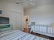 Shared bedroom offers two beds, a closet, and a view into the hallway at 2367 Camden Ter, The Villages, FL 32162