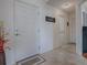 Bright entryway with neutral tile flooring, offering a welcoming transition into the home's living spaces at 2367 Camden Ter, The Villages, FL 32162