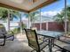 Enjoy Florida evenings on this screened patio with a tile floor and view of the landscaped yard at 2367 Camden Ter, The Villages, FL 32162