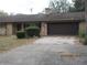 Charming home with a two-car garage and driveway at 2416 Spring Lake Rd, Fruitland Park, FL 34731