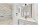 Bathroom featuring a modern marble tiled shower and sleek fixtures at 2701 Ne 10Th St # 307, Ocala, FL 34470