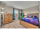 Comfortable bedroom with natural light, carpeted floor, and ample space at 2727 Retriever Dr, Clermont, FL 34711