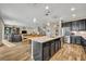 Open-concept living area with kitchen, dining, and living spaces at 2727 Retriever Dr, Clermont, FL 34711