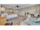Spacious main bedroom featuring a tray ceiling, ceiling fan, and ensuite bathroom at 2727 Retriever Dr, Clermont, FL 34711