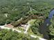 Beautiful aerial view of the property's lush landscape surrounded by greenery, creating privacy at 2886 N C 470, Lake Panasoffkee, FL 33538