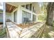 This home has a spacious wooden deck overlooking a serene backyard, perfect for entertaining at 2886 N C 470, Lake Panasoffkee, FL 33538