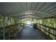 Covered wooden boardwalk features benches, lighting, and access to the water at 2886 N C 470, Lake Panasoffkee, FL 33538