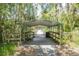 Boardwalk features benches and lighting, and access to the water with lush foliage all around at 2886 N C 470, Lake Panasoffkee, FL 33538