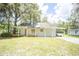 Charming single-story home featuring a covered carport and a front porch for relaxing outdoors at 2886 N C 470, Lake Panasoffkee, FL 33538