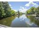 Picturesque lake view from a wooden bridge, capturing the serenity of the surrounding nature at 2886 N C 470, Lake Panasoffkee, FL 33538