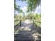 Charming wooden bridge over a peaceful body of water surrounded by natural beauty at 2886 N C 470, Lake Panasoffkee, FL 33538
