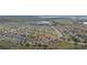Beautiful aerial shot of a residential community with meticulously designed streetscapes at 303 Red Kite Dr, Groveland, FL 34736