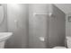 This bathroom features a pedestal sink, toilet, towel rack, and light gray walls at 303 Red Kite Dr, Groveland, FL 34736