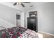 Bedroom with ceiling fan, carpet floor, gray walls, dresser, and a full-sized bed at 303 Red Kite Dr, Groveland, FL 34736