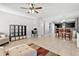 This living room features an open floor plan, tile floors, and natural light at 303 Red Kite Dr, Groveland, FL 34736