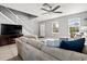 Comfortable living room with natural light, stylish furnishings, and a staircase leading to the upper level at 303 Red Kite Dr, Groveland, FL 34736