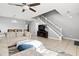Spacious living room with open floorplan, featuring stylish decor, tile flooring and a ceiling fan at 303 Red Kite Dr, Groveland, FL 34736