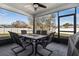 Relaxing screened-in patio with ample seating and views of the spacious backyard and neighborhood at 303 Red Kite Dr, Groveland, FL 34736