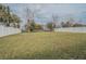 Fenced back yard with a view of the water at 3339 Landing Vw, Tavares, FL 32778