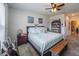 Serene bedroom featuring soft blue accents, a cozy bed, and ample natural light at 3339 Landing Vw, Tavares, FL 32778