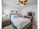 Bedroom with ceiling fan, wood furniture, and decoratively framed artwork at 3339 Landing Vw, Tavares, FL 32778