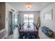 Bright dining room with a large wooden table, seating for ten and sliding glass door at 3339 Landing Vw, Tavares, FL 32778