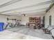Spacious garage with ample storage and a lawn mower at 3339 Landing Vw, Tavares, FL 32778