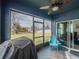 Screened porch with ceiling fan, furniture, and view of the fenced backyard at 3339 Landing Vw, Tavares, FL 32778